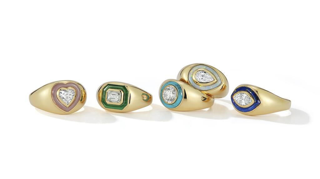 The “Bubble Ring” capsule collection from Maggi Simpkins consists of 1-carat diamonds (with the exception of the round diamond, which is 1.1 carats) set in 18-karat gold and framed by colored gemstone inlay. The pieces are, from left, the “Heart” framed by pink opal ($15,980 retail), the “Emerald” framed by malachite ($14,200), the “Round” framed by turquoise ($17,500), the “Pear” framed by opal ($14,980), and the “Marquise” framed by lapis lazuli $14,980). 20220714_Maggi Simpkins group.jpg
